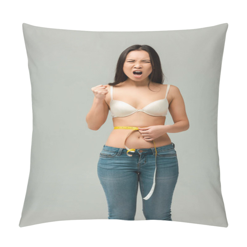 Personality  emotional and overweight asian girl measuring waist and screaming isolated on grey  pillow covers