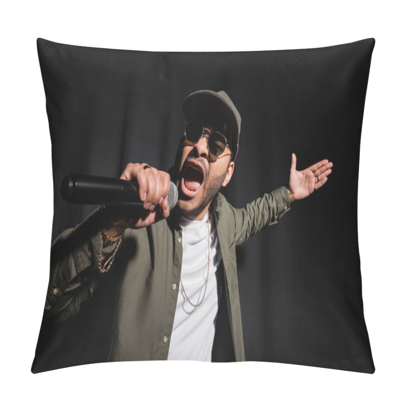 Personality  emotional eastern hip hop performer in sunglasses singing in microphone on black pillow covers