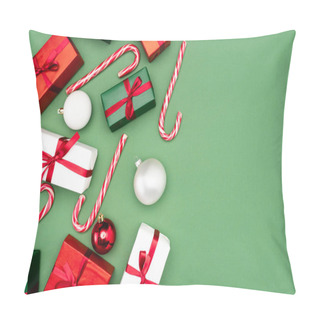 Personality  Top View Of Multicolored Gift Boxes, Candy Canes And Christmas Balls On Green Background Pillow Covers
