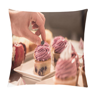 Personality  Cropped Shot Of Confectioner Decorating Sweet Cupcake With Berry Pillow Covers