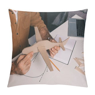 Personality  Cropped Shot Of Man Holding Cardboard Plane Model While Modeling At Home Pillow Covers