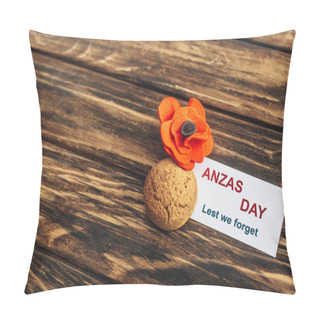 Personality  Card With Anzas Day Lettering Near Artificial Flower And Cookie On Wooden Surface  Pillow Covers