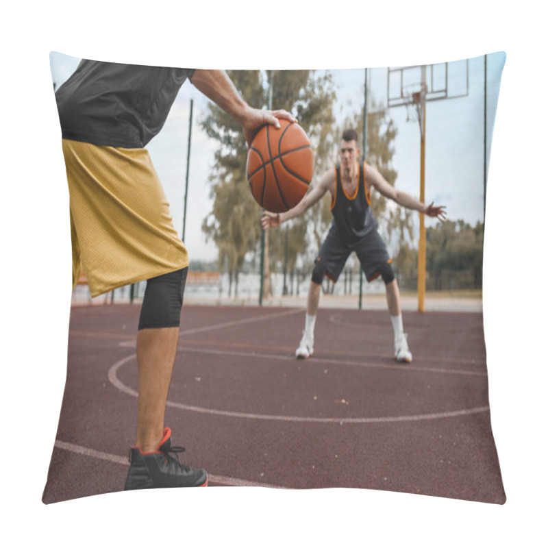 Personality  Two basketball players work out tactics on outdoor court. Male athletes in sportswear play the game on streetball training pillow covers