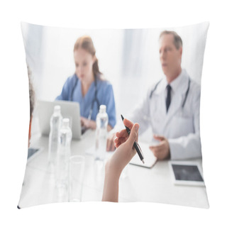 Personality  African American Nurse Holding Pen Near Colleagues On Blurred Background In Clinic  Pillow Covers