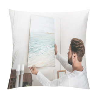 Personality  Young Bearded Man Hanging Picture On Wall At Home Pillow Covers