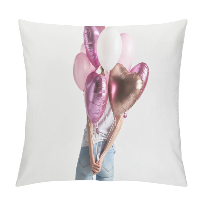 Personality  back view of girl in denim holding heart-shaped pink air balloons isolated on white pillow covers