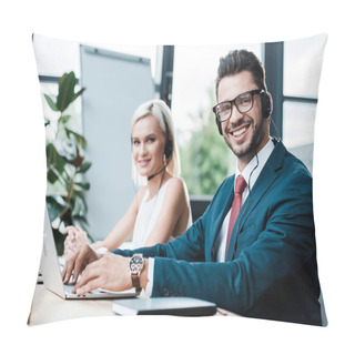 Personality  Selective Focus Of Cheerful  Man In Headset Typing On Laptop While Sitting Near Blonde Colleague  Pillow Covers