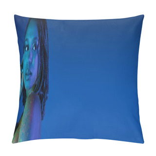 Personality  Sensual African American Woman With Dreadlocks And Bare Shoulder, In Radiant Colorful Neon Body Paint Looking Away On Blue Background With Cyan Lighting Effect, Banner Pillow Covers