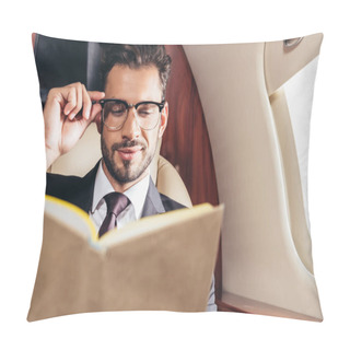 Personality  Selective Focus Of Handsome Businessman In Suit Reading Book In Private Plane  Pillow Covers