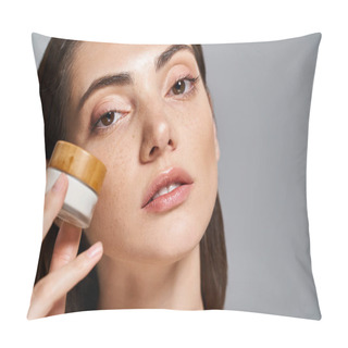 Personality  A Young Caucasian Woman With Brunette Hair Applying Cream From A Jar To Her Face, Enhancing Her Skins Radiance. Pillow Covers