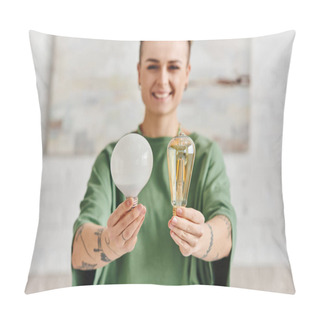 Personality  Cheerful, Young And Tattooed Woman In Casual Clothes Showing Energy Saving Light Bulbs And Looking At Camera, Environmentally Conscious, Sustainable Lifestyle And Environmentally Conscious Concept Pillow Covers