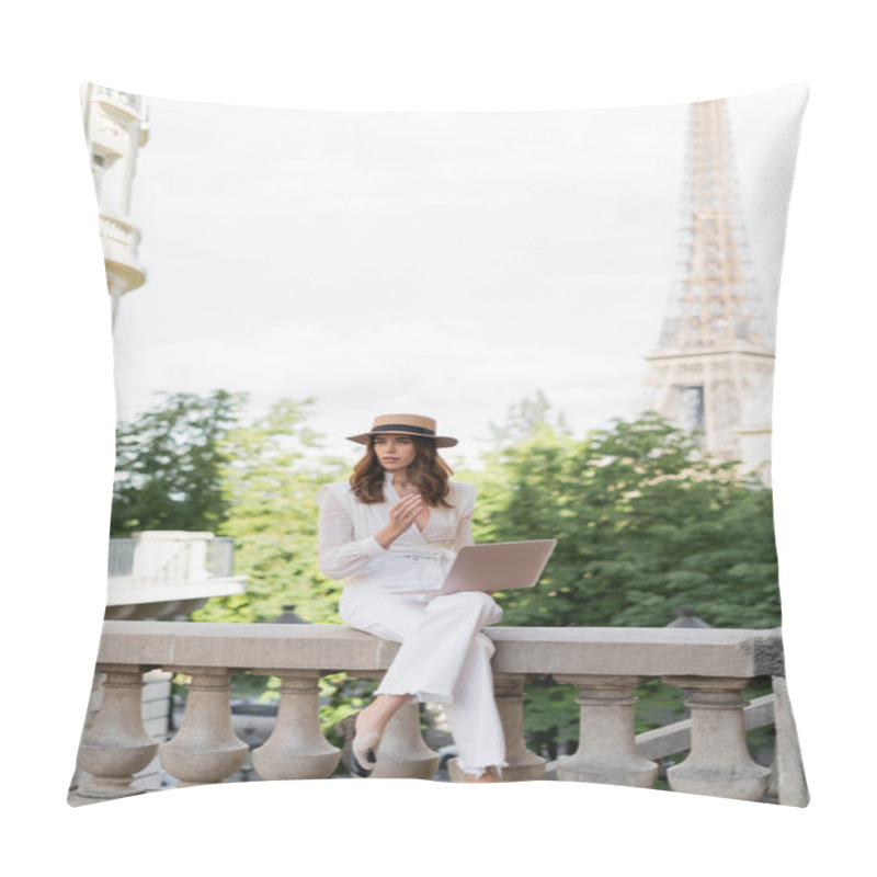 Personality  Trendy woman in sun hat holding laptop on street with Eiffel tower at background in Paris  pillow covers