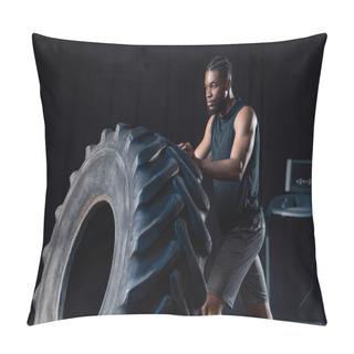Personality  Serious African American Sportsman Training With Tire And Looking Away Pillow Covers