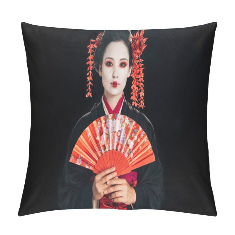 Personality  beautiful geisha in black kimono with red flowers in hair holding traditional hand fan isolated on black pillow covers