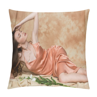 Personality  Seductive Young Woman With Brunette Hair Lying In Silk Slip Dress On Linen Fabric Near Delicate White Flowers On Mottled Beige Background, Sensuality, Sophistication, Elegance, Eustoma  Pillow Covers