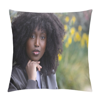 Personality  A Thoughtful African American Woman With Voluminous Afro Hair And A Black Leather Jacket Poses Against A Blurred Natural Background With Yellow Flowers, Conveying Introspection And Style Pillow Covers