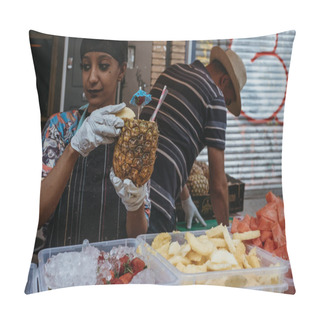 Personality  London, UK - July 21, 2018: Woman Preparing A Tropical Drink Served Inside A Fresh Pineapple At A Market Stall In Portobello Road Market, One Of The Most Popular Tourist Sites In London, UK. Pillow Covers