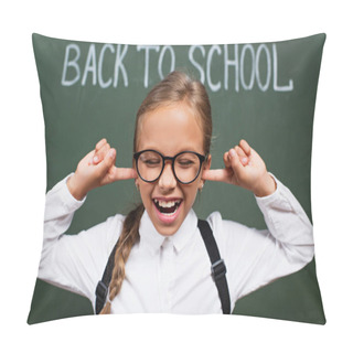 Personality  Selective Focus Of Displeased Schoolgirl In Eyeglasses Plugging Ears With Fingers Near Back To School Inscription On Chalkboard Pillow Covers
