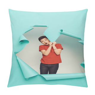 Personality  Shocked Asian Preteen Boy Red T-shirt Looking At Camera And Touching Hole In Blue Paper While Celebrating Child Protection Day On White Background Pillow Covers