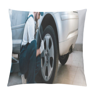 Personality  Panoramic Shot Of Handsome Bearded Car Mechanic In Uniform Changing Car Tire In Car Service  Pillow Covers