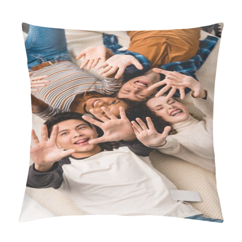 Personality  overhead view of smiling multiethnic teens waving hands pillow covers