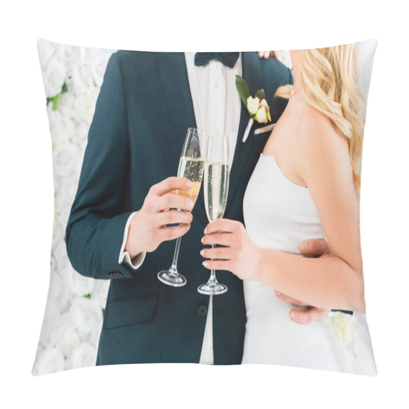 Personality  Cropped View Of Groom And Bride Holding Glasses Of Champagne On White Floral Background Pillow Covers