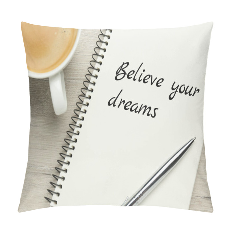 Personality  Motivational quote Believe Your Dreams written in notebook on wooden table, flat lay pillow covers