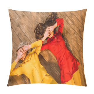 Personality  Top View Of Retro Styled Girls In Colorful Dresses Lying On Floor And Covering Eyes With Hands At Home Pillow Covers