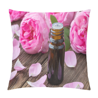 Personality  A Dark Bottle Of Essential Oil With Fresh Roses On A Wooden Background Pillow Covers