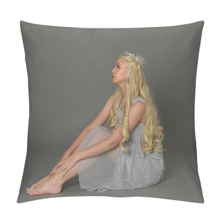 Personality  Full Length Portrait Of Blonde Woman Wearing Crown And Pale Blue Dress. Seated Pose Against A Grey Studio Background. Pillow Covers