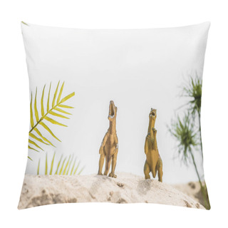 Personality  Selective Focus Of Toy Dinosaurs Roaring On Sand Dune With Tropical Leaves Pillow Covers