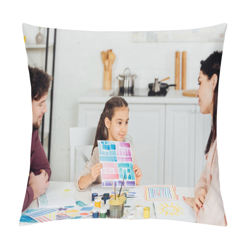Personality  cheerful kid holding paper with colorful stripes near parents at home  pillow covers