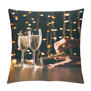 Personality  Cropped Image Of Woman Opening Present Near Champagne Glasses On Garland Light Background, Christmas Concept Pillow Covers