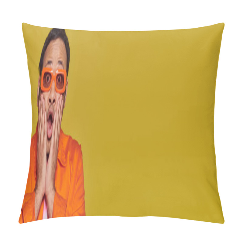 Personality  shocked indian man in orange sunglasses touching face and saying wow on yellow backdrop, banner pillow covers