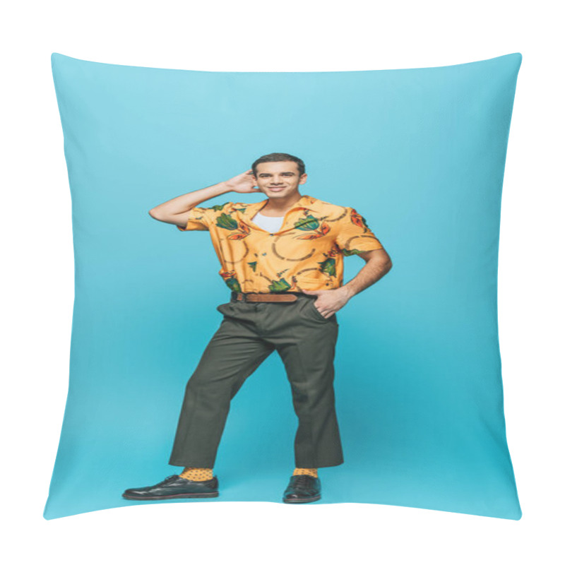 Personality  handsome dancer looking at camera while dancing boogie-woogie on blue background pillow covers