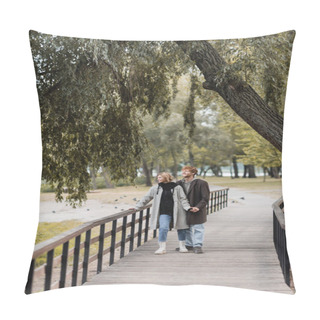 Personality  Full Length Of Redhead Man And Blonde Woman In Coat Smiling While Holding Hands On Bridge Near Pond In Park  Pillow Covers