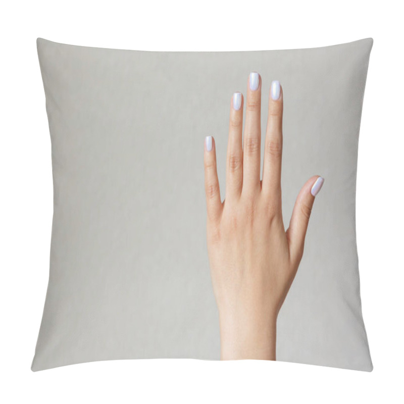 Personality  Gesture and sign, female hand showing stop on a light background. Empty space for text pillow covers