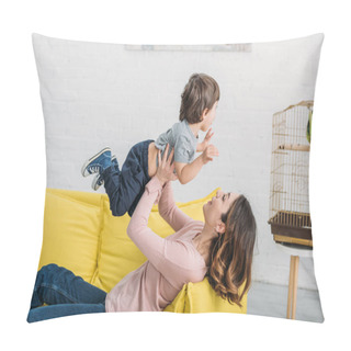 Personality  Happy Young Mother With Adorable Boy Having Fun On Yellow Sofa Near Bird Cage With Green Parrot Pillow Covers