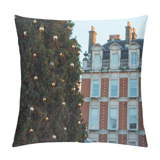 Personality  A Large Christmas Tree Adorned With Gold Baubles And Fairy Lights Stands In London, UK, Against A Backdrop Of Red Brick Townhouses With Whitetrimmed Windows Under An Overcast Winter Sky. Pillow Covers