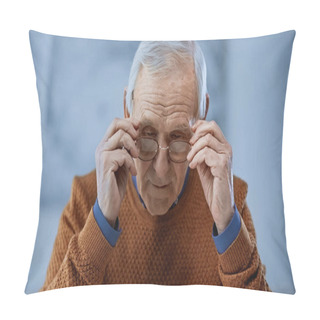 Personality  Concentrated Elderly Man Adjusting Glasses On Grey Background Pillow Covers
