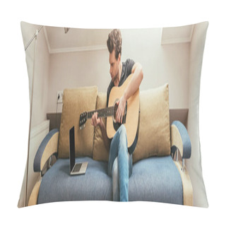 Personality  Horizontal Image Of Young Man Playing Guitar While Sitting On Sofa And Looking At Laptop With Blank Screen Pillow Covers
