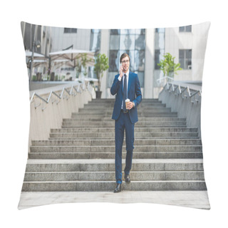 Personality  Smiling Young Businessman In Stylish Suit With Coffee To Go Talking By Phone While Walking By Stairs Near Business Building Pillow Covers