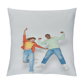 Personality  Happy Interracial Couple In Casual Attire Jumping Together On Grey Backdrop, Youthful Spirit Pillow Covers