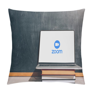 Personality  KYIV, UKRAINE - JULY 7, 2020: Laptop With Zoom Website On Stacked Textbooks Near Black Chalkboard Pillow Covers