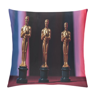 Personality KYIV, UKRAINE - JANUARY 10, 2019: Shiny Golden Oscar Award Statuettes On Black Background Pillow Covers