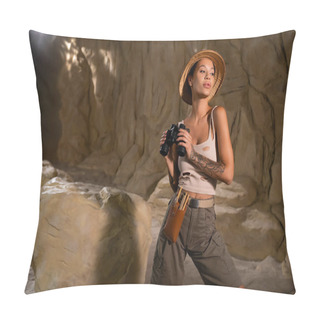 Personality  Tattooed Archaeologist In Holey Top And Safari Hat Holding Binoculars Near Rock In Cave Pillow Covers