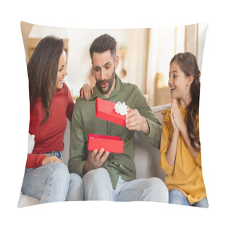 Personality  Excited Father Unboxing A Red Gift With His Family, Capturing A Moment Of Joy And Surprise On The Couch Pillow Covers