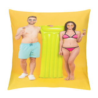 Personality  Happy Muscular Man And Cheerful Woman In Swimwear And Sunglasses Holding Ice Cream While Standing Near Inflatable Mattress On Yellow  Pillow Covers