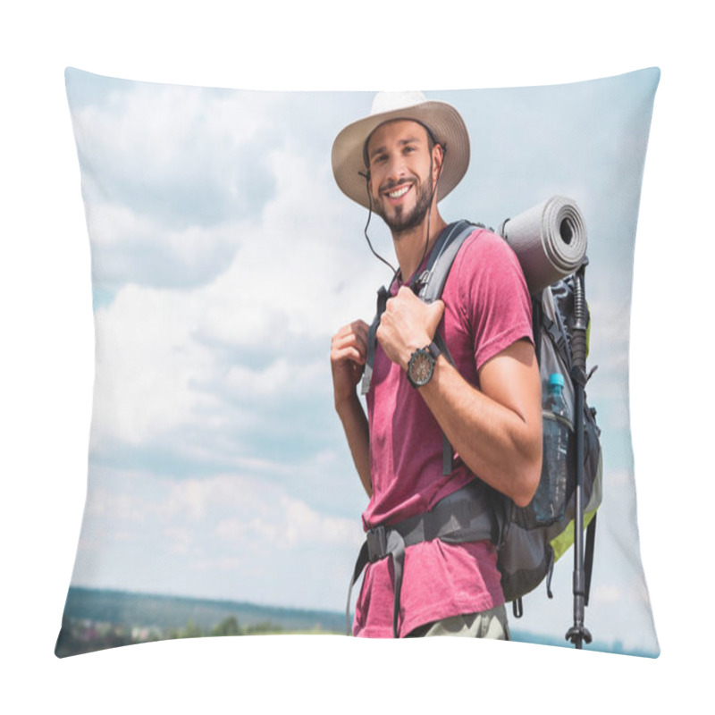 Personality  smiling traveler in hat with backpack and tourist mat looking at camera pillow covers