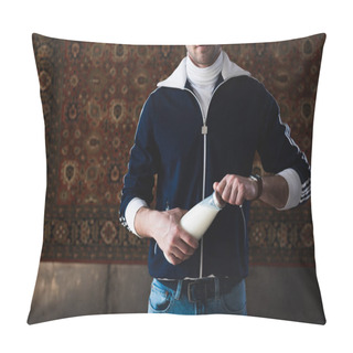 Personality  Cropped Shot Of Young Man In Vintage Clothes With Bottle Of Milk In Front Of Rug Hanging On Wall Pillow Covers